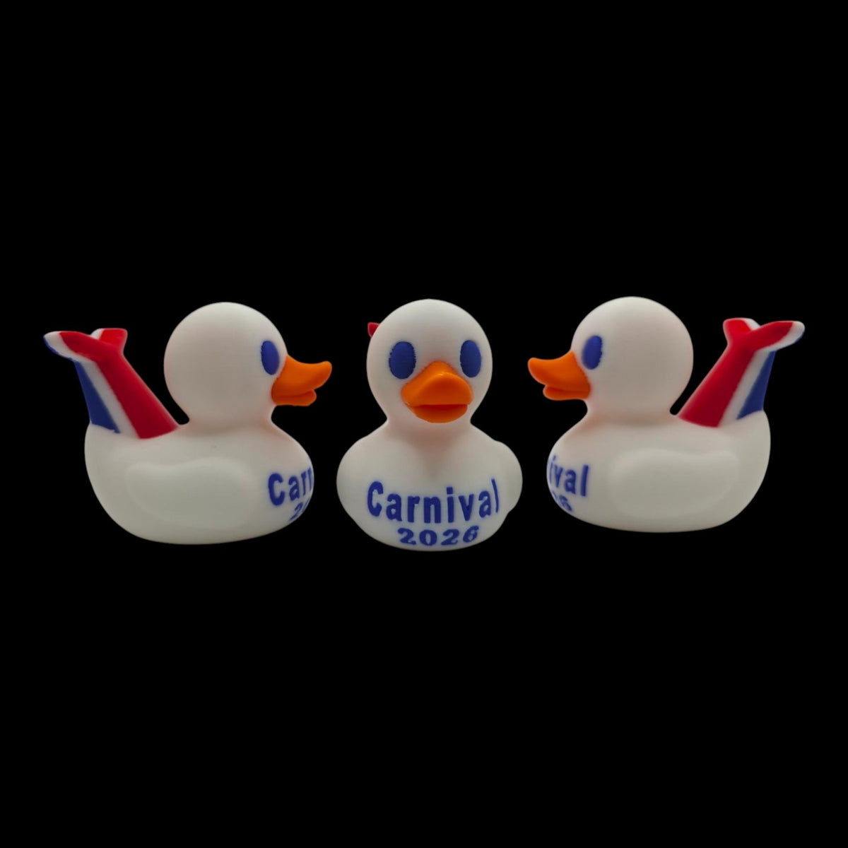 Front and rear-side views of a white 3D printed cruise duck highlighting its raised red-and-blue whale tail. - JM Designs