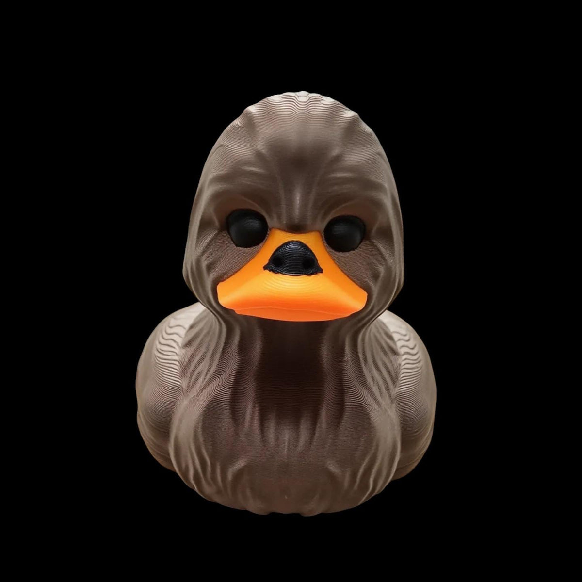 May include: A brown rubber duck with a textured surface that resembles a wookiee.