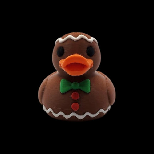 Gingerbread Rubber Duck Christmas Bath Toy Holiday Decoration Brown Body White Icing Trim Orange Bill Black Eyes Green Bow Tie Red Buttons Festive Bathroom Accessory Novelty Gift Idea Winter Decor Collectible Item Stocking Stuffer Holiday