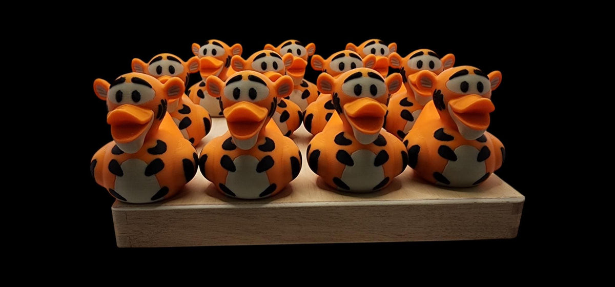 Tigger-inspired 3D printed orange striped duck figurine - view 6