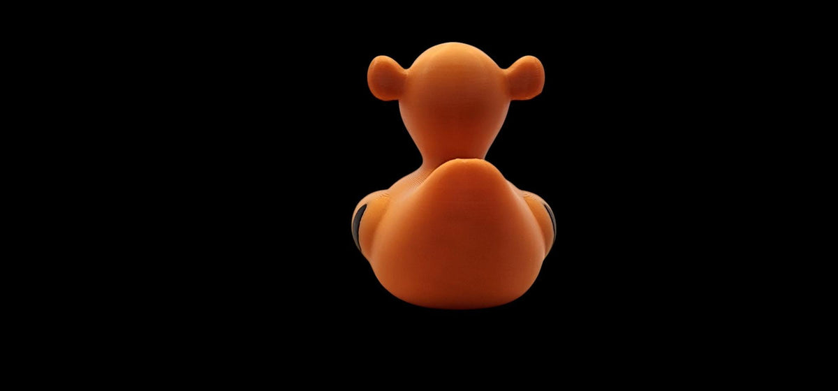 Tigger-inspired 3D printed orange striped duck figurine - view 3